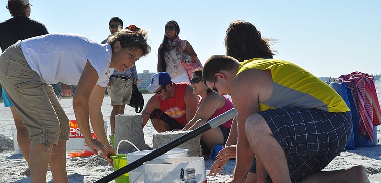 Lara Hines, a local sand sculptor, starts the second session of Crystal Classic sand sculpting Oct. 13, at Siesta Key beach.
