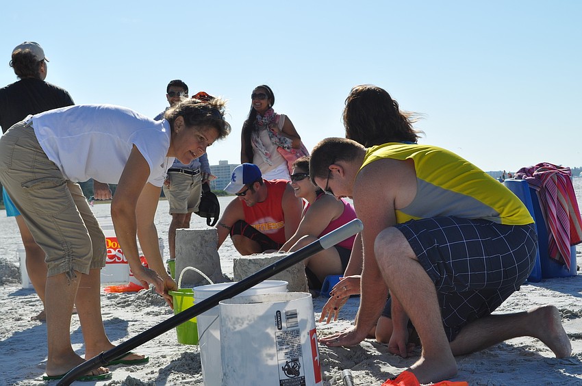 Lara Hines, a local sand sculptor, starts the second session of Crystal Classic sand sculpting Oct. 13, at Siesta Key beach.