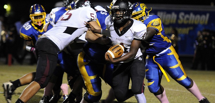 Braden River freshman Breyon Pittman attempts to break for the outside during the Pirates non-district game at Bayshore Oct. 11.