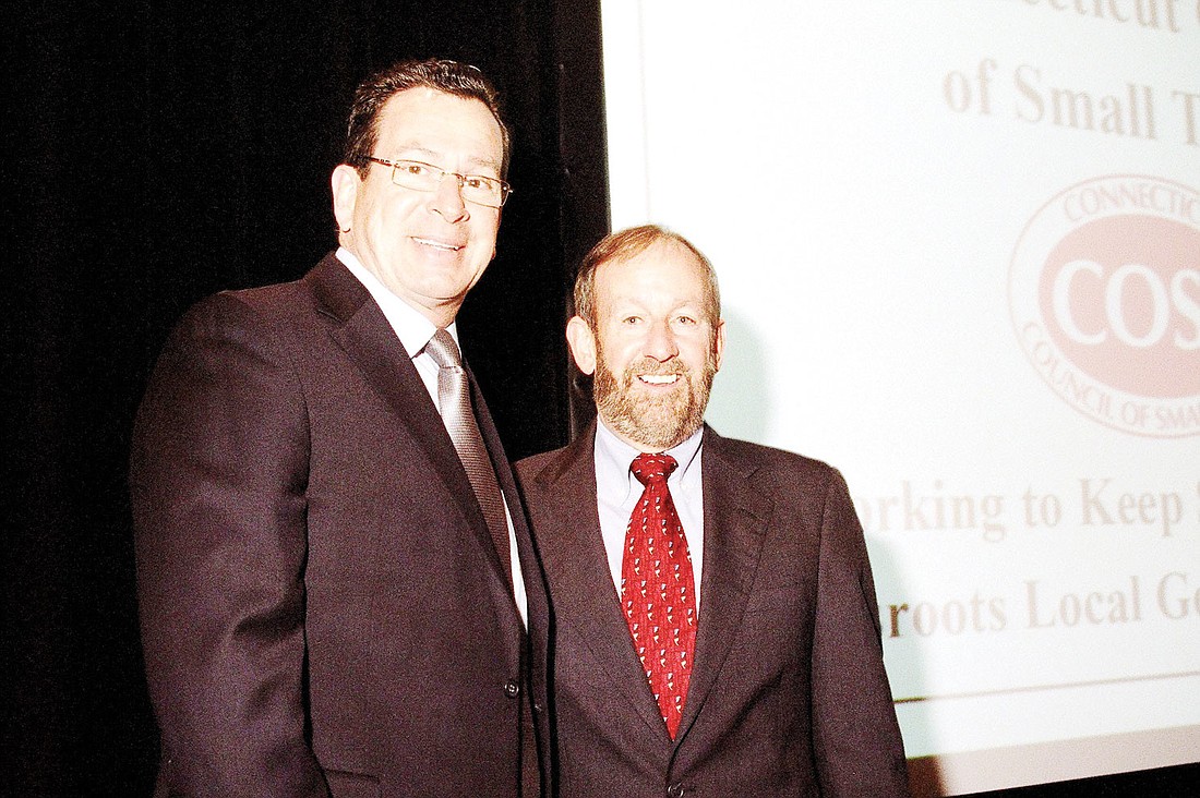 Connecticut Gov. Dannel Malloy honored Bart Russell at a recent reception organized by the Connecticut Council of Small Towns in honor of Russell's retirement. Courtesy.