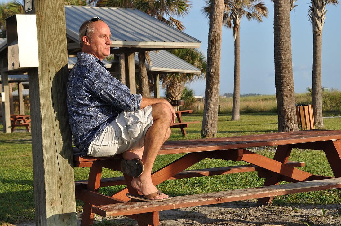 Jim Judsen looks out on a spot on Siesta Key Beach that used to bring surfers together.
