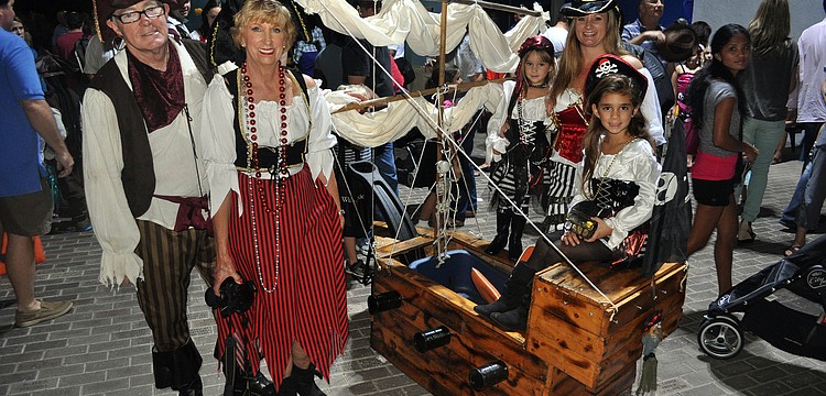 Tim and Juliette Johnson, Leana Skye Montalvo, 3, Terjiana Montalvo and Isabella Montalvo, 6, came all the way from Tampa with their handmade â€œboatâ€ Friday, Oct. 19, to attend MOTEâ€™s Night of Fish, Fun and Fright.