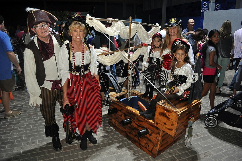 Tim and Juliette Johnson, Leana Skye Montalvo, 3, Terjiana Montalvo and Isabella Montalvo, 6, came all the way from Tampa with their handmade â€œboatâ€ Friday, Oct. 19, to attend MOTEâ€™s Night of Fish, Fun and Fright.