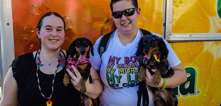 Megan Howard brought her dog Karuso and Rebecca Alles came with her dog Sterling to celebrate Pride Fest 2012.