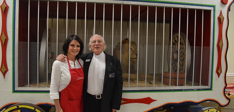 Rev. Fausto Stampiglia poses for a photo with Beth Cannata, Chair of the Hospitality Committee.