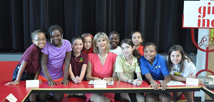 Mayor Suzanne Atwell sits with students at Girls Inc.