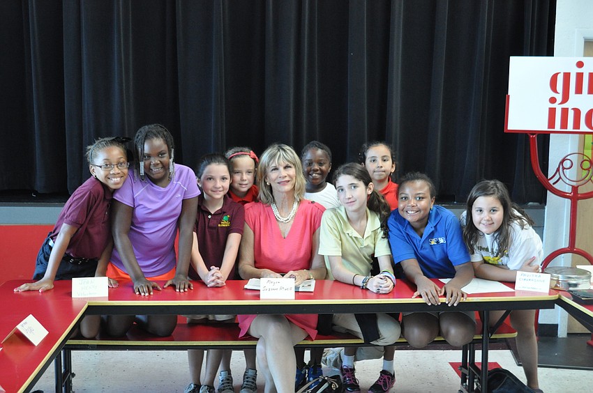 Mayor Suzanne Atwell sits with students at Girls Inc.