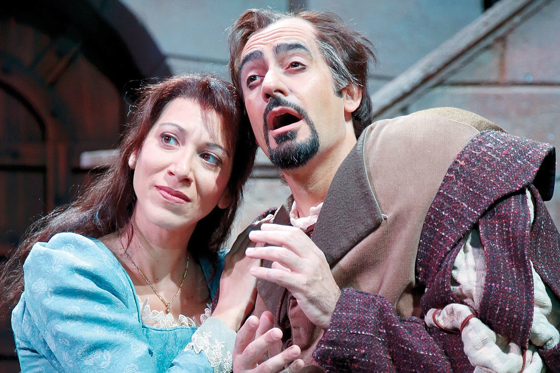 Soprano Eleni Calenos as Gilda and baritone Marco Nistico as the cursed jester in "Rigoletto." Photo by Rod Millington.