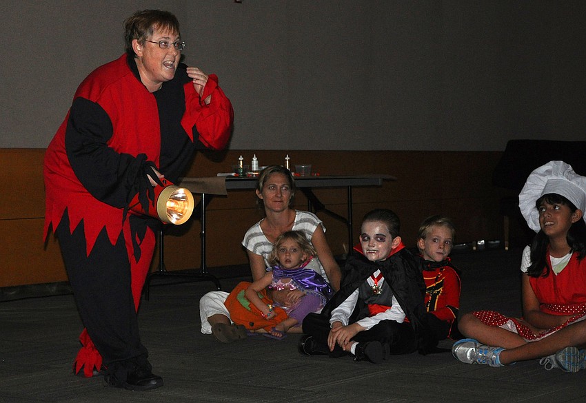Marilyn Nykiforuk, assistant manager at Selby Public Library, tells a not so scary, scary story Wednesday, Oct. 24, at Selby Public Libraryâ€™s Halloween Party.