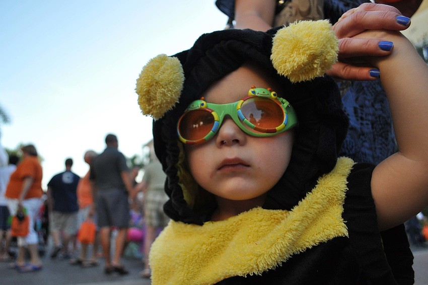 Damian Bruns, 2, stayed close to his mom.