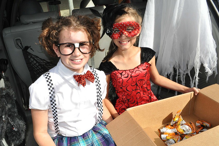 Leila Parks and Abigail Widunas passed out candy during the trunk-or-treat.