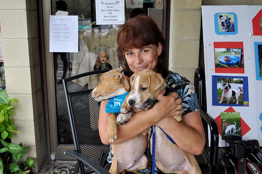 Iris Eastman with two adoptable dogs, Speed and Hudson.