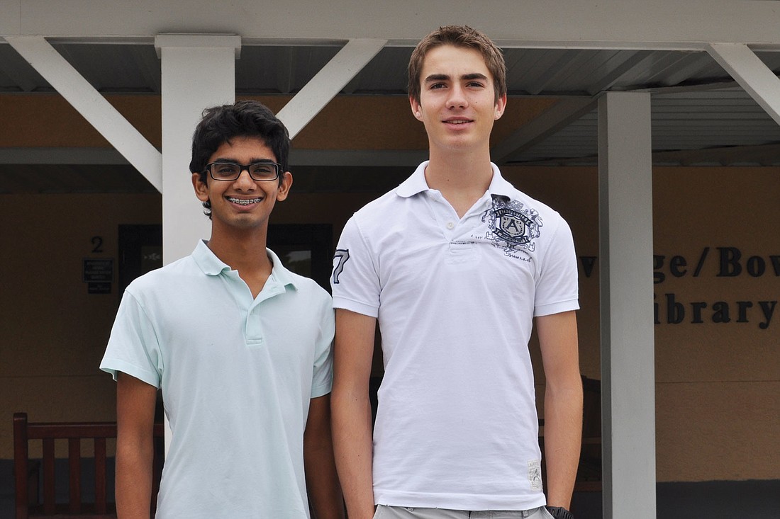 Janum Trivedi, left, and Marcus Buffet, right, both 17-year-old students from The Out-of-Door Academy, created an iPhone app that helps users manage their money.