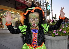 Giordana Spagnolo, 6, does her scariest witch impression Wednesday, Oct. 31, on St. Armands Circle. Spagnolo lost her first tooth that day which added to her scary witch persona.