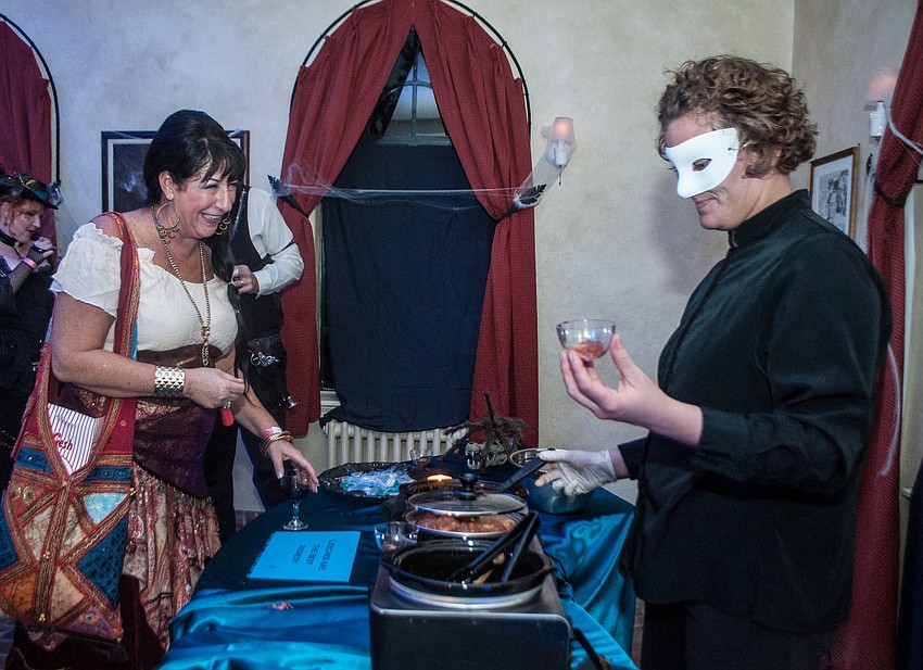 Vicki Alexander makes a potion to ward of the plague in the blue room.