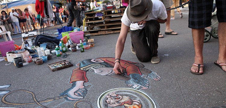 Ruben Poncia works on his piece â€œFlea Circusâ€.
