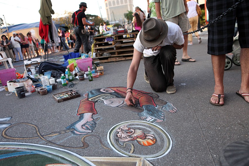 Ruben Poncia works on his piece â€œFlea Circusâ€.