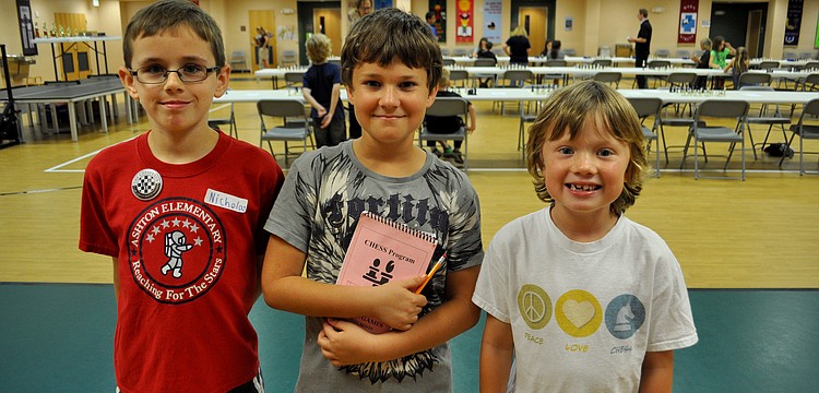 Niocholas Clifton, Ari Ginsberg-Klemmt and Jaden Probus pose after finishing their games.