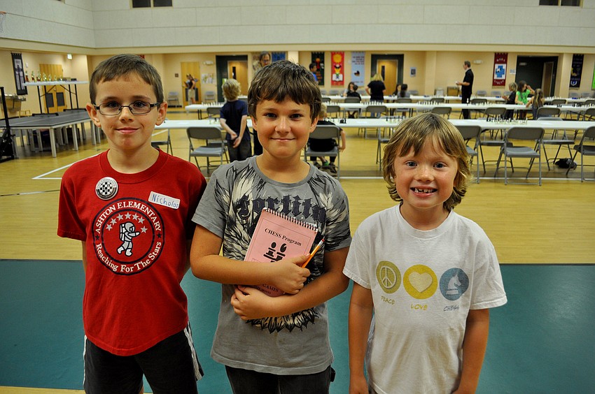 Niocholas Clifton, Ari Ginsberg-Klemmt and Jaden Probus pose after finishing their games.