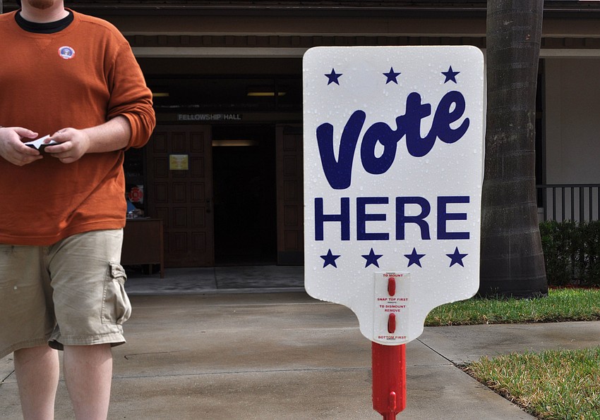 A man walks past wearing his 