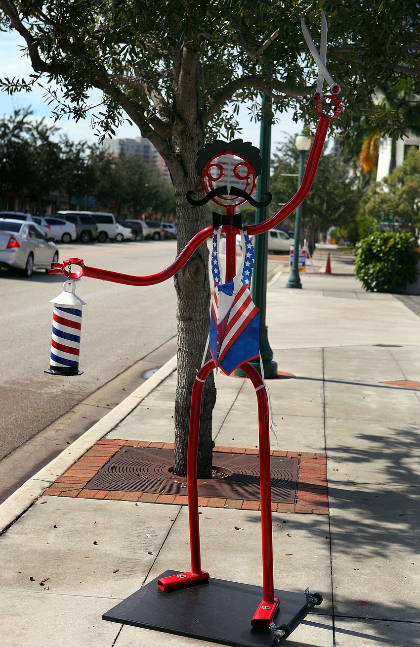 The Tube Dude outside of the Barber Shop on Main Street wore a patriotic, plastic vest Wednesday, Nov. 6, Election Day.
