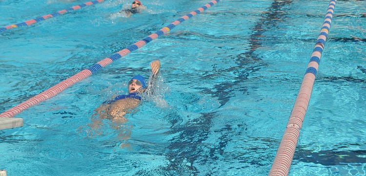 Alexis Zinkl a sophomore at Canterbury High School competes in the girls 100-yard breaststroke.