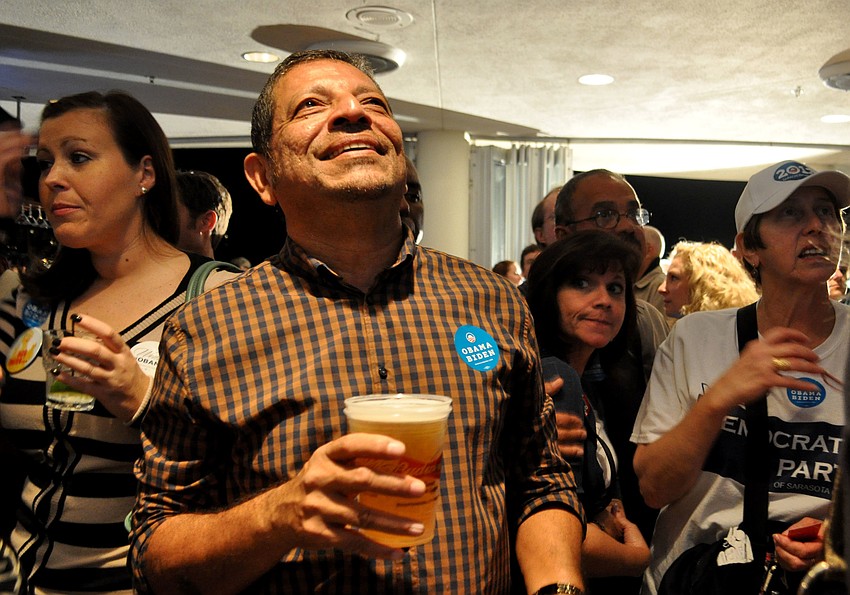 Philip Abraham watches as presidential results come in.