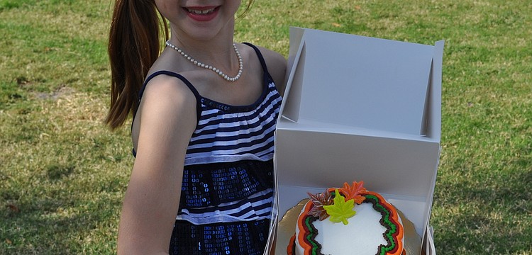 Kendall Douley won the cake walk competition.