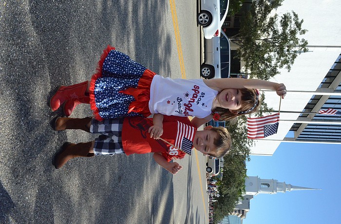 Siblings Claire and Hudson Toale waved their American flags.