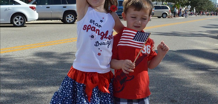 Siblings Claire and Hudson Toale waved their American flags.