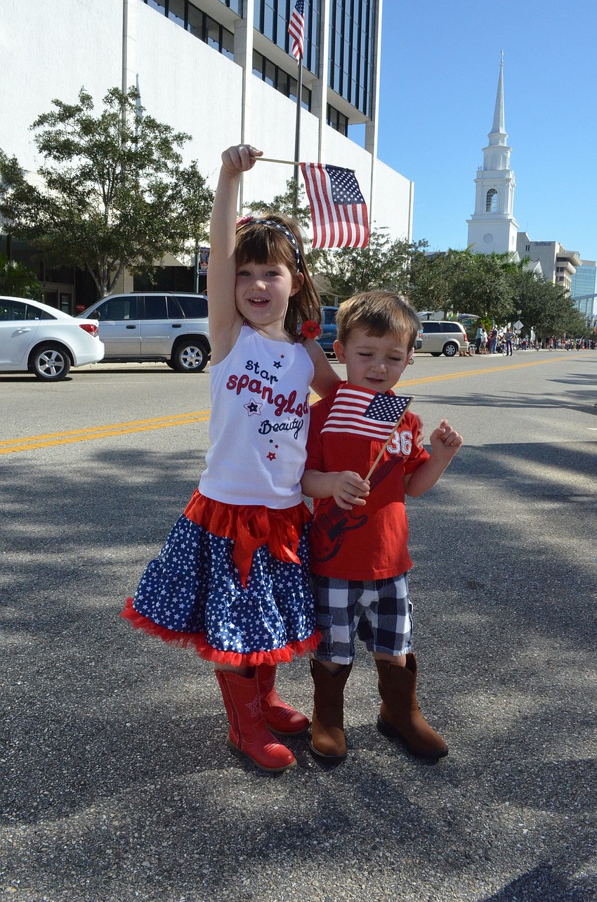 Siblings Claire and Hudson Toale waved their American flags.
