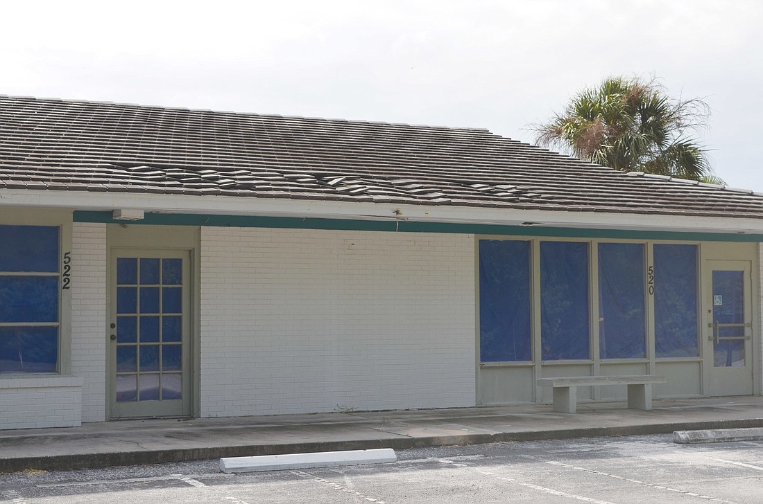 A caving roof in the post office building at Whitney Beach Plaza concerns town officials.