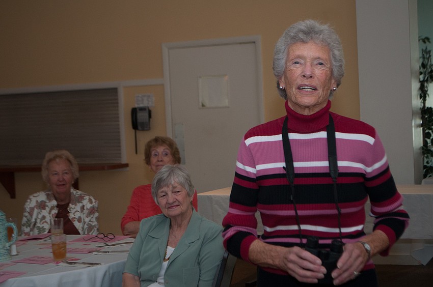 Cynthia Smyth sports a striped turtleneck.