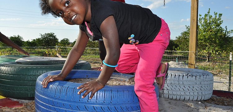 Courtney Harris played on a tire.