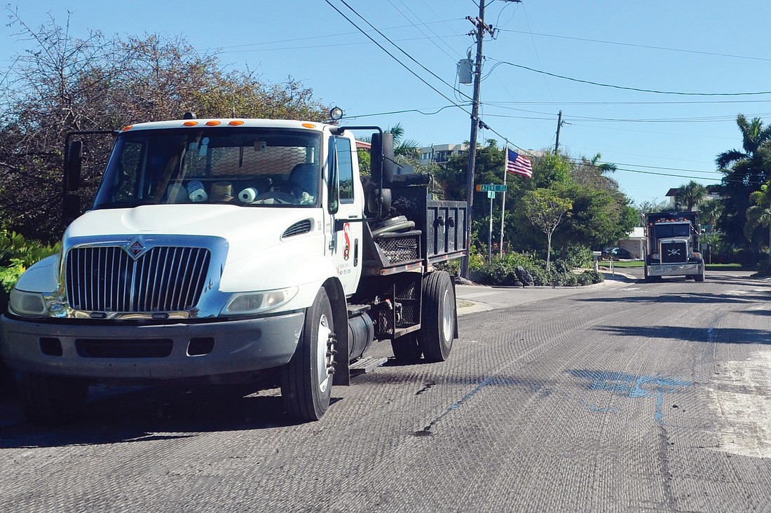 Superior Asphalt Inc. prepares Cape Leyte Drive for new asphalt as part of a $2.9 million contract that includes resurfacing eight Siesta Key streets.