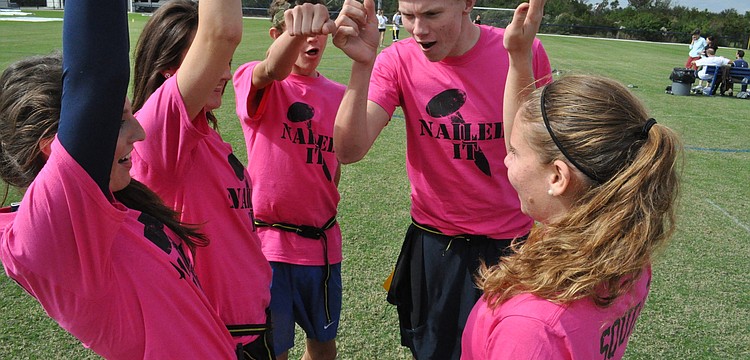 Members of Team Nail It huddled with excitement, before the start of their next match-up.