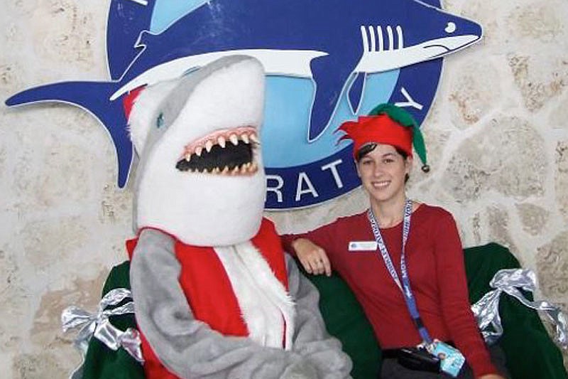 Gilly the Shark, aka Santa Jaws, with Mote Public Relations Coordinator Hayley Rutger.