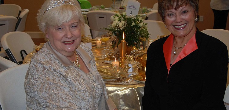 Sheri Miller and Jeanne Larranaga posed for a photo while wearing their tiaras.
