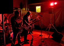 Members of the open jam band perform blues standards.