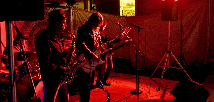 Members of the open jam band perform blues standards.