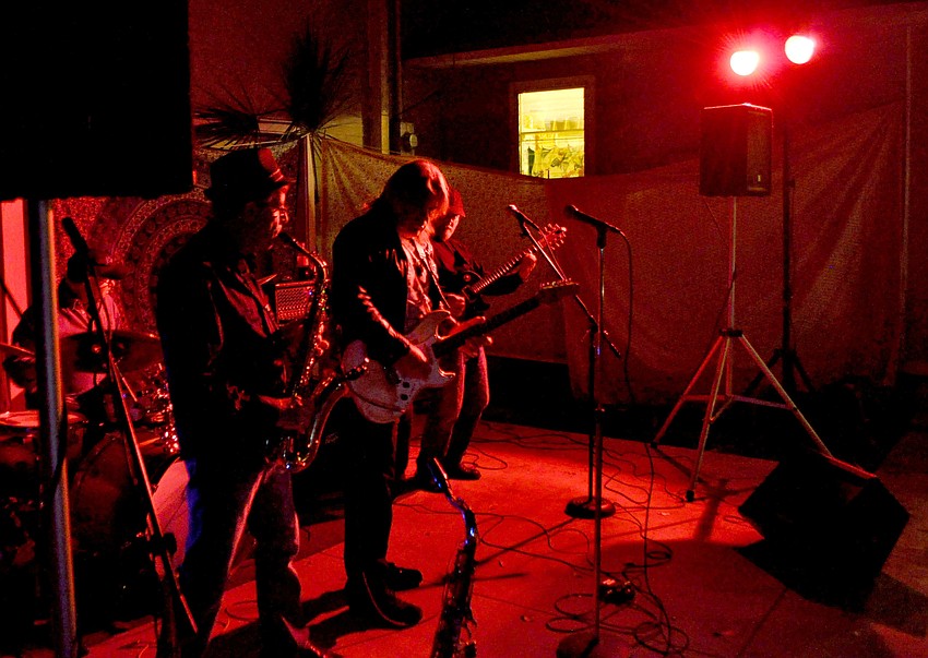 Members of the open jam band perform blues standards.
