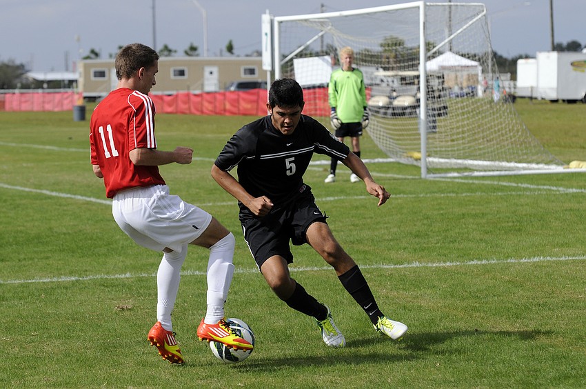 Braden River Highâ€™s Juan Morales looks to regain possession during the Pirates game vs. Clearwater in the Nike Thanksgiving High School Soccer Tournament Nov. 20.
