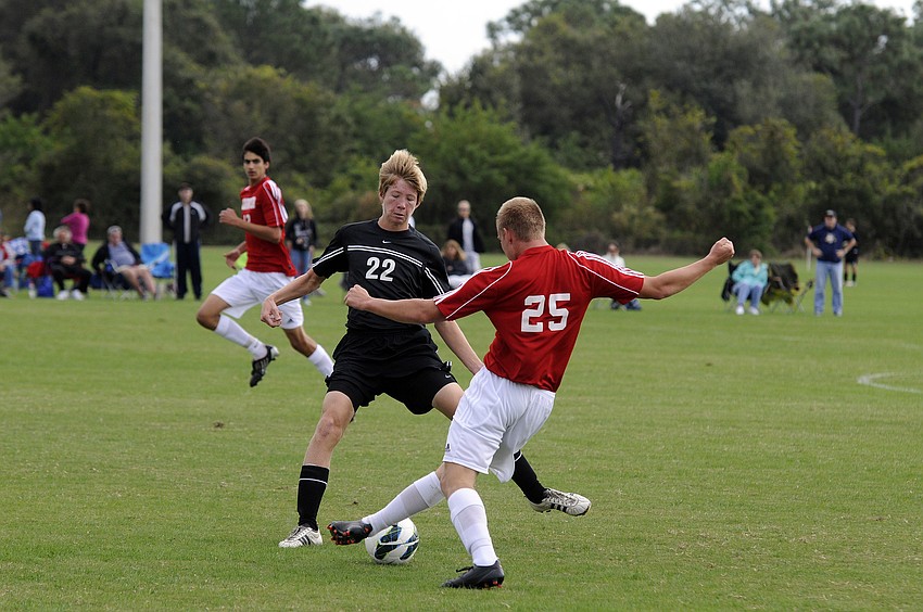 Braden Riverâ€™s Matt Tschiggfrie looks to keep a Clearwater player from bringing the ball further up the field.