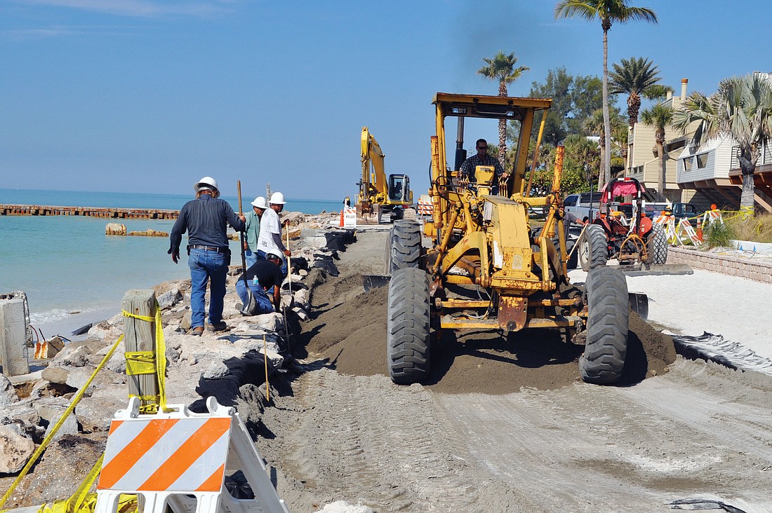Fred Derr & Co. workers restore the collapsed portion of Beach Road on Siesta Key. Photo by Rachel S. O'Hara.