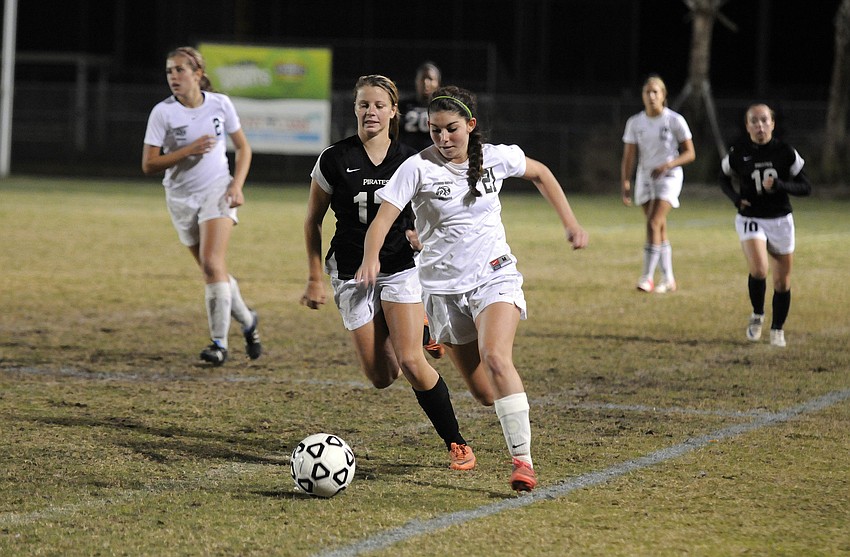 Lakewood Ranch junior midfielder Angelica Rego pushes the ball up the field.