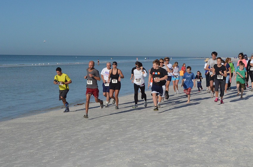 Runners and walkers begin the 5K.