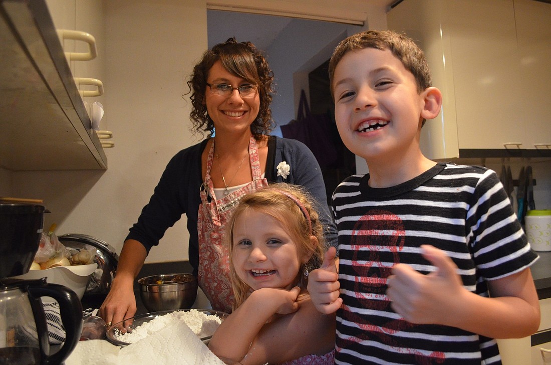 Rachel Lenerz makes sufganiyot with her 4-year-old daughter, Ava, and her 6 -year-old son, Leo.