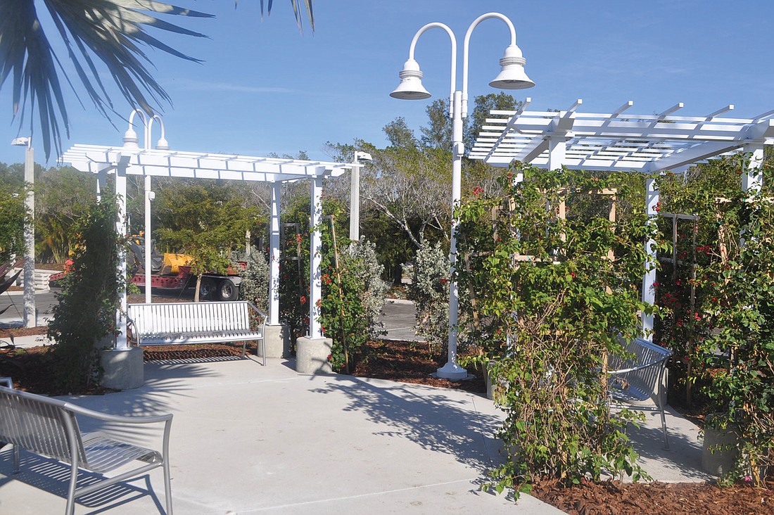 A seating area between Publix and CVS offers a shaded spot to enjoy the new shopping center.