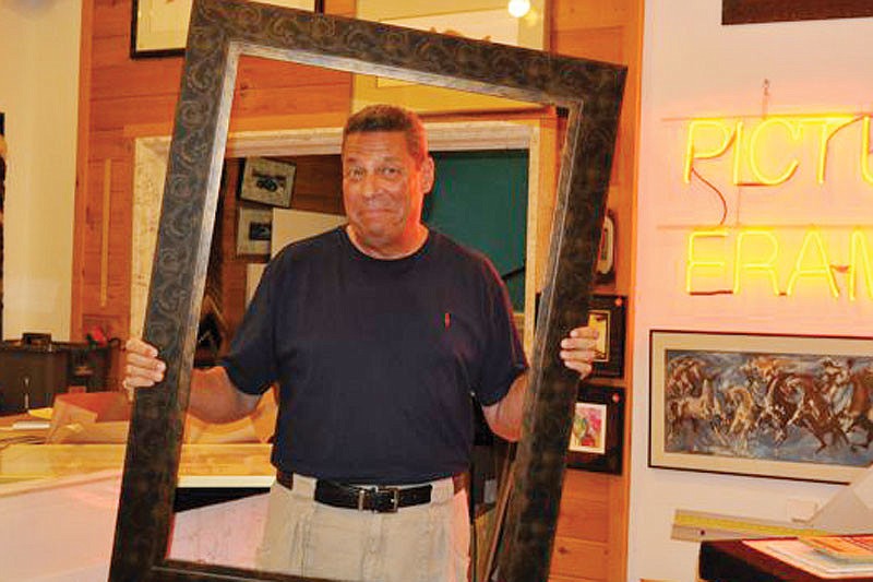 Terry Petesch, pictured in 2010, framed many prized possessions, in addition to artwork and photographs. File photo.