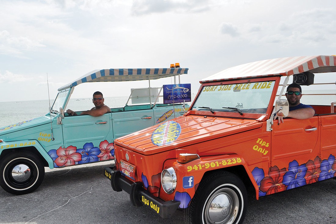 Tony and Chris Aveni, of Surf Side Free Ride, take passengers around Siesta Key for free with their 1973 Volkswagen Things.
